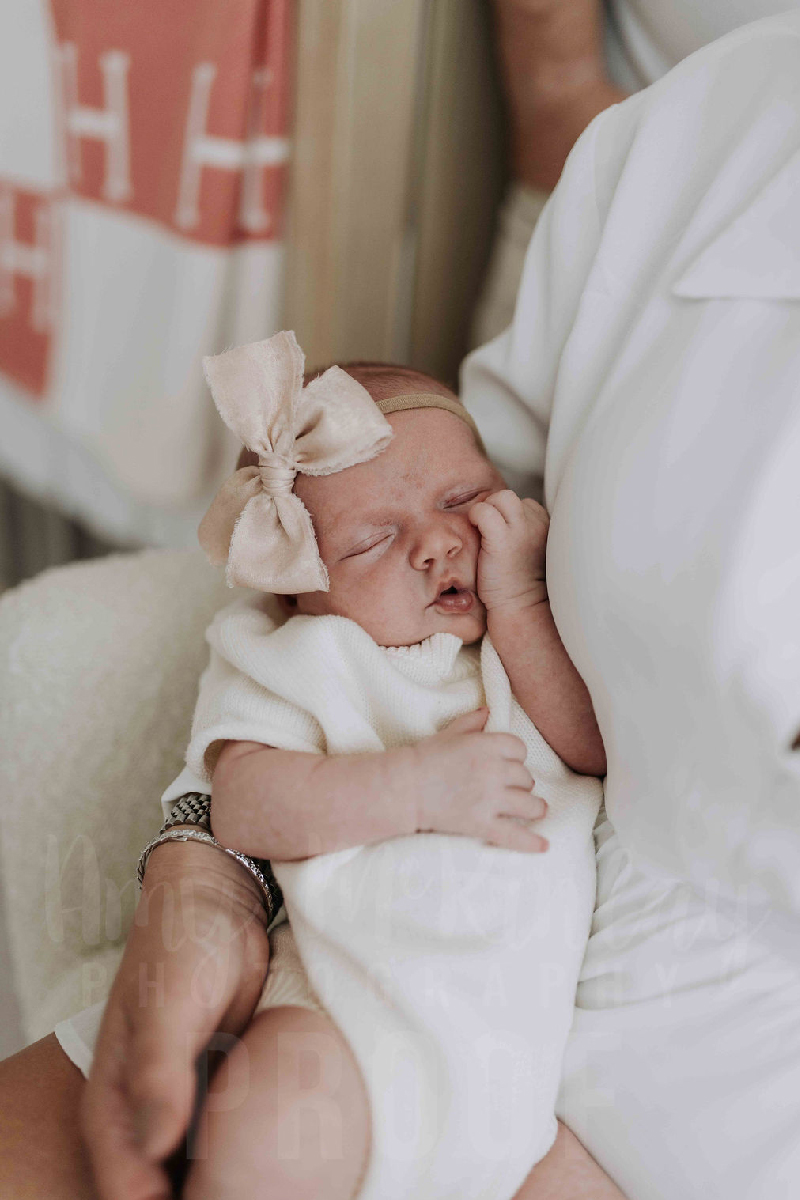 Newborn baby Layla Rose Johnson smilin